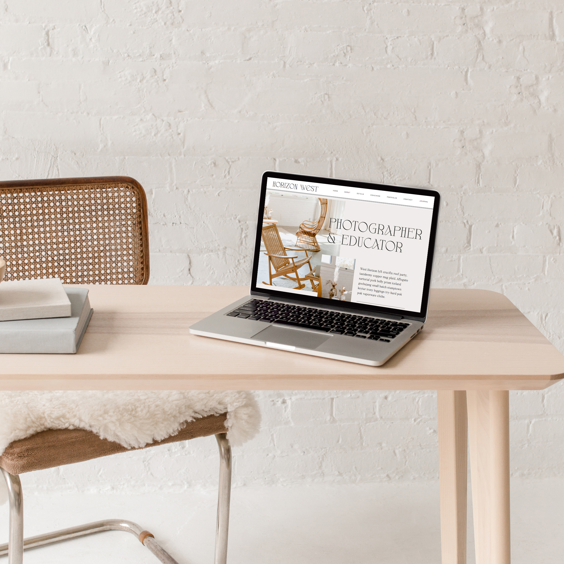 laptop on table with website mockup